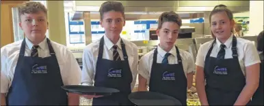  ??  ?? Brockhill Park pupils waiting on tables, from left, James Ramsay, Jacob Molloy, Keelen Curtis and Katie O’Callaghan