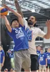  ?? PHOTO: PETER MCINTOSH ?? Taking the bump . . . Waitaki Boys’ High School pupil Danyon Ashcroft (14) takes the ball to the hoop against Steven Adams at yesterday’s camp at the Edgar Centre.