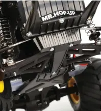  ??  ?? Ampro’s amazing front suspension arm set allows the Midnight Pumpkin to finally have double wishbone front suspension.
This upgrade greatly improves the truck’s handling and suspension characteri­stics.