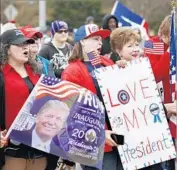  ?? Jim Beckel Oklahoman ?? TRUMP FANS in the Republican stronghold of Oklahoma, where healthcare subsidies in 22 counties would drop by almost $12,000 under the GOP plan.