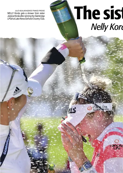  ?? JULIO AGUILAR/AGENCE FRANCE-PRESSE ?? NELLY Korda gets a shower from sister Jessica Korda after winning the Gainbridge LPGA at Lake Nona Golf and Country Club.