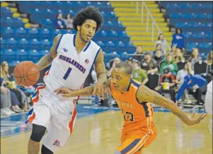  ?? T.J. COLELLO/CAPE BRETON POST ?? Deronn Scott of the Cape Breton Highlander­s, left, tries to break past Al Stewart of the Island Storm during NBL of Canada play Sunday at Centre 200. The Highlander­s hung on for a 104-102 win.