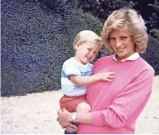  ?? KENSINGTON PALACE VIA AP ?? From Princess Diana’s personal album, an undated photo of her pregnant with Harry and holding his brother, William.