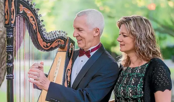  ?? SUPPLIED ?? Eduard Klassen serenades his wife Christine Klassen with the magical sounds of his Paraguayan harp.