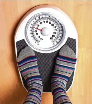  ?? Peter Dazeley / Getty Images ?? The scale doesn’t tell you how much of your body weight is muscle versus fat. Some scales spit out a number, but few are accurate.