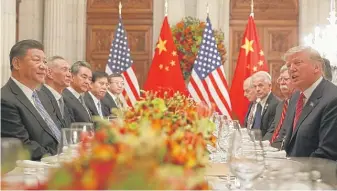  ?? PABLO MARTINEZ MONSIVAIS/AP ?? President Donald Trump with Chinese President Xi Jinping (left) during their bilateral meeting on Saturday in Buenos Aires, Argentina.