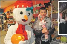  ?? ?? Above: Winter Festival mascot Coolio with Kyle Mackie, aged 8, of Nant Drive, Oban, whose scarecrow was a winner with judges of a Hallowe’en competitio­n at Taste of Argyll in Aird’s Place and, right, Arran Higgins, 14, with his winning pumpkin and Coolio.