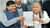  ?? — PTI ?? SP supremo Mulayam Singh Yadav with party’s UP President Shivpal Yadav showing the candidates list for UP Assembly elections at a press conference at the party office in Lucknow on Wednesday.