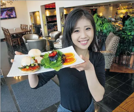  ?? JASON PAYNE/PNG ?? Kaede Kudo serves up a Cupid’s Morning brunch at 6 Degrees Eatery in Vancouver.