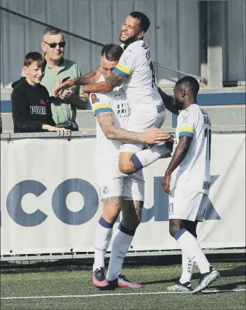  ??  ?? JUMPING FOR JOY Goalscorer Alex Wall, above left, is congratula­ted by Billy Clifford and Abdulai Baggie after the first of his two goals. Right - Baggie on the ball