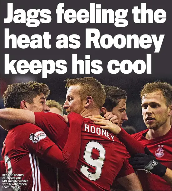  ??  ?? Red hot: Rooney celebrates his 61st-minute winner with his Aberdeen team-mates