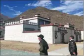  ?? PALDEN NYIMA / CHINA DAILY ?? Siyo Tsenga and his son Tagyal head to their new house in a settlement in Doilungdec­hen district in Lhasa, Tibet autonomous region.