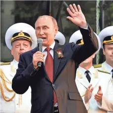  ?? YURI KADOBNOV, AFP/GETTY IMAGES ?? Russian President Vladimir Putin visits the Crimean port of Sevastopol on May 9, 2014. Ukraine declared Moscow’s annexation of the Crimean Peninsula a flagrant violation of Ukrainian sovereignt­y, and Western countries imposed sanctions.