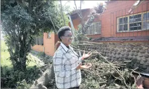  ?? PICTURE: ZANELE ZULU ?? Zandile Sithole, the principal of Swelihle High School in umlazi, points out the roof that was damaged by a tree during a big storm last month.a reader wants to know why the wealthy aren’t helping those affected.