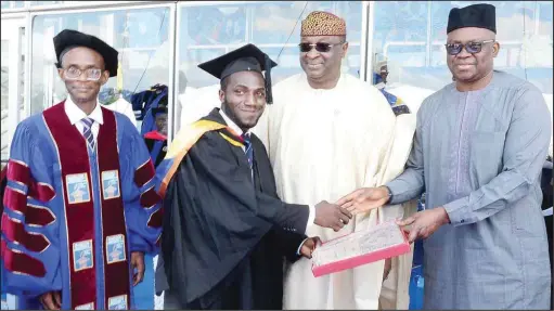  ??  ?? R-L: Ekiti State Governor, Ayodele Fayose; Ogun State Chief of Staff, Mr. Tolu Odebiyi; the best graduating student, Mr. Agbojo Adedotun; and the Vice-Chancellor, Babcock University, Ogun State Prof. Ademola Tayo, during the 16th undergradu­ate and...