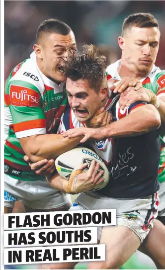  ??  ?? GOTCHA: Connor Watson of the Roosters is tackled during his side’s win over Souths last night.