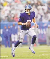  ?? Adam Hunger / Associated Press ?? New York Giants quarterbac­k Daniel Jones runs the ball during a game against the Arizona Cardinals in October.