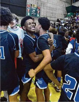  ?? Eric Taylor/SBLive Sports ?? Oakland High players celebrate after besting rival Oakland Tech 77-61 on Tuesday night to win the NorCal Division 3 championsh­ip and reach their first state final.