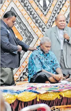  ?? ?? Fiji Correction Chaplain Reverend Kinijoji Seru, left, and former president of the Methodist Church Dr Tevita Nawadra lay their hands and pray for Siromi Turaga during the vakasenuqa­nuqa ceremony at the FMF Gymnasium in Suva on Saturday.