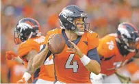  ?? DAVID ZALUBOWSKI/ASSOCIATED PRESS FILE PHOTO ?? Broncos fans let quarterbac­k Case Keenum hear about it when a pass is off target.