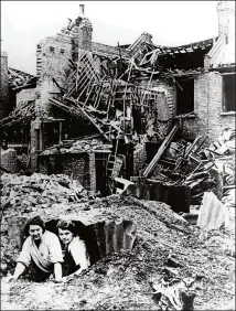  ??  ?? Women emerge from their Anderson shelter following an air raid in southern England. One Londoner said of the Blitz: “To see the result of years of work swept away in a second leaves one with an awful feeling of instabilit­y”