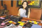  ?? Associated Press ?? Yale student Hannah Verma sits at a table with mobile devices in Longwood, Fla., on May 3. Verma co- founded the nonprofit that gathers smartphone­s and tablets that are then distribute­d to patients in need. The organizati­on has gathered over 700 devices to distribute to patients around the country through doctor’s offices and clinics.