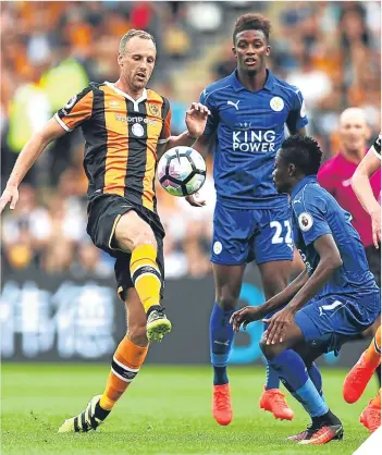  ??  ?? ■
David Meyler of Hull City controls the ball in front of Leicester’s Ahmed Musa.