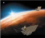  ?? NASA/JPL-CALTECH VIA AP ?? This illustrati­on made available by NASA on March 29, 2018 shows the twin Mars Cube One (MarCO) spacecraft flying over Mars with Earth and the sun in the distance.