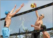  ?? ERIC LICAS — STAFF PHOTOGRAPH­ER ?? Chase Budinger, right, battles Tri Bourne at the net during the AVP Hemosa Beach Open on Saturday.