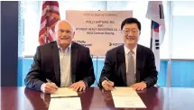  ?? HD Hyundai ?? Joo Won-ho (right), head of HD Hyundai Heavy Industries’ special ship business unit, and Steinar Nerbovik, CEO of Philly Shipyard, sign a memorandum of understand­ing in Pennsylvan­ia on April 12.