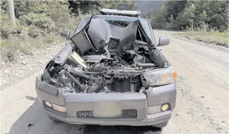  ??  ?? A forester’s car after it collided with a logging truck on Bamfield Main. Many accidents on the road are the result of dust obscuring visibility.