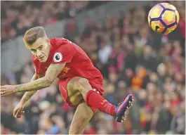  ?? — AFP ?? LIVERPOOL: Liverpool’s Brazilian midfielder Philippe Coutinho attempts a shot at goal during the English Premier League football match between Liverpool and Watford at Anfield in Liverpool, north west England yesterday.
