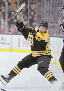  ?? STAFF FILE PHOTO By MATT STONE ?? BACK IN BLACK ’N’ GOLD: The Bruins re-signed defenseman Matt Grzelcyk to a two-year deal worth $1.4 million per season.