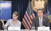  ?? Mary Altaffer / Associated Press ?? Melissa Derosa, secretary to the governor, is joined by Gov. Andrew Cuomo at a 2018 news conference. She acknowledg­ed in a meeting last week that their office delayed providing nursing home data to the state Legislatur­e.