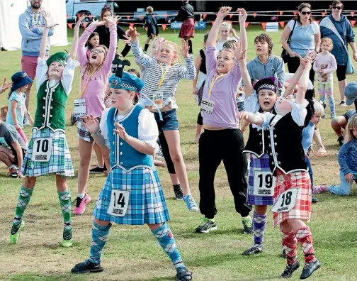  ?? BARRY HARCOURT/634046501 ?? Time for a lollie scramble at the Te Anau Tartan Festival on Saturday.