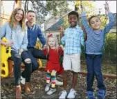  ?? THE ASSOCIATED PRESS ?? Stephanie and Lance Schmidt pose for a photo with their children, from left, Stella, Solomon and Theo, at their home in Oklahoma City. The Schmidts have opted for a cost-sharing ministry this year.