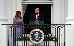  ?? AP/ALEX BRANDON ?? President Donald Trump, with first lady Melania Trump at his side, addresses military families attending a July Fourth picnic Wednesday on the White House grounds.