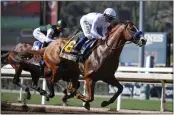  ?? JAE C. HONG — THE ASSOCIATED PRESS ?? Justify, ridden by Mike Smith, is pictured during the 2018 Santa Anita Derby. His victory was taken away Friday.