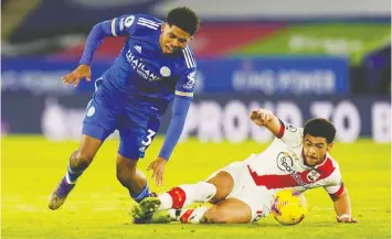  ?? — REUTERS ?? Leicester City's Wesley Fofana and Southampto­n's Che Adams Pool fight for control of the ball in English Premier League action on Saturday.