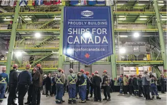  ?? DARREN CALABRESE, CANADIAN PRESS ?? Workers in the assembly hall at the Irving Shipyard following the announceme­nt that the Royal Canadian Navy will receive a sixth Arctic and offshore patrol ship.