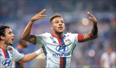  ?? LAURENT CIPRIANI / AP ?? Lyon’s Corentin Tolisso celebrates scoring against Montpellie­r during their French Ligue 1 match in Decines, France, on Sept 21, 2016. Bayern on Wednesday opened its vault to sign Tolisso for $53 million.