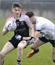  ??  ?? St Attracta’s Conor Murray wins this midfield battle.