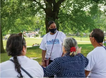  ?? AMAnDA SAbgA / boSton HerALD ?? CAMPBELL: Boston City Councilor and mayoral candidate Andrea Campbell chats with recent Northeaste­rn graduate Beatrice Soler and her parents Mike and Marisol as she campaigns at the Common Sunday.