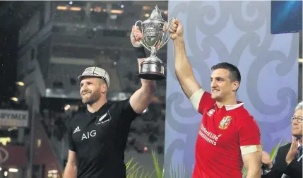  ?? Picture: David Rogers/Getty ?? British & Irish Lions captain Sam Warburton, right, holds the trophy with New Zealand captain Kieran Read after the three-match Test series had been drawn in Auckland last year