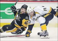  ?? AP PHOTO ?? Nashville Predators defenceman Mattias Ekholm, right, checks Pittsburgh Penguins forward Conor Sheary to the ice during Game 1 of the Stanley Cup Finals on Monday.