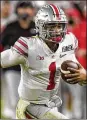  ?? AP ?? Ohio State quarterbac­k Justin Fields completed 70.2 percent of his passes in eight games for the Buckeyes last season.