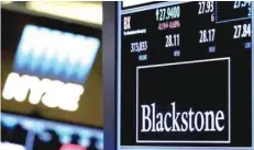  ?? — Reuters ?? The ticker and trading informatio­n for Blackstone Group is displayed at the post where it is traded on the floor of the New York Stock Exchange.