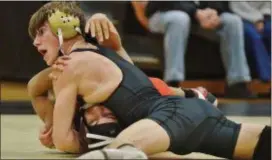  ?? KYLE FRANKO — TRENTONIAN PHOTO ?? Hopewell Valley’s Chris Lanciano, top, pins Rahway’s Corey Boss, bottom, during their 126-pound bout on Wednesday night.