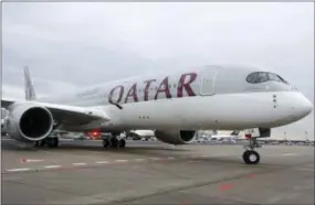  ?? AP PHOTO/MICHAEL PROBST ?? A new Qatar Airways Airbus A350 approaches the gate at the airport in Frankfurt, Germany. As the indignitie­s of modern air travel go, the latest ban on laptops and tablets on some internatio­nal flights falls somewhere between having to take off your...