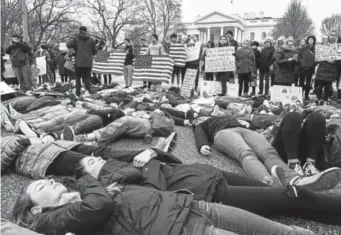  ?? Bill O’leary, The Washington Post ?? Students stage a “lie-in” last Monday outside the White House in response to the Feb. 14 school shooting in Florida. The teens said they want stronger gun control and vowed to be heard on the issue.